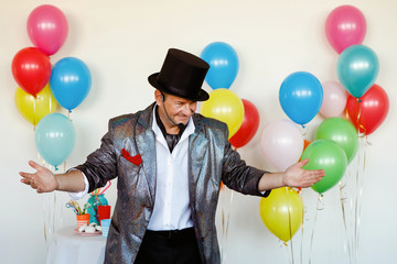 Magician in a black hat.