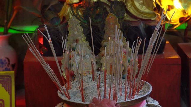 Incense in the pot with smoke coming out. In the shrine when accepting the Chinese New Year
