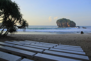 Coral island, waves, which adorn the beauty of the morning atmosphere at Gunungkidul Beach, Yogyakarta.