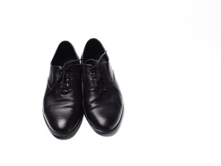A pair of men's shoes made of genuine leather polished to a Shine, isolate on a white background
