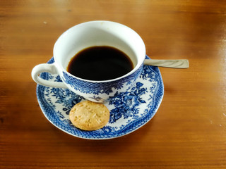 A cup of coffee on the wooden table