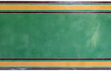 The wall is painted green and yelloe colour background and texture.
