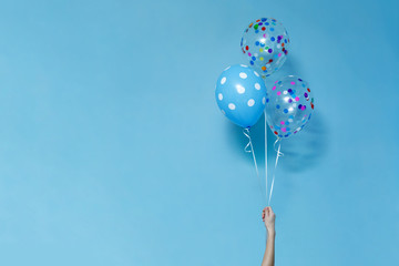 stylish birthday party or holidays with balloons close up. blue  balloons isolated  on the blue...