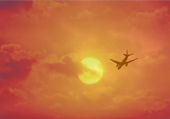 Fototapeta na wymiar aircraft flying into the sunset 