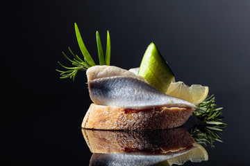 Atlantic herring with lemon, green cucumber, onion and rosemary.