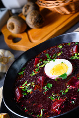 Delicious beetroot borscht with egg