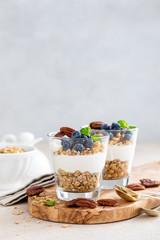 Blueberry layered parfait with ricotta cheese, granola and pecan nuts