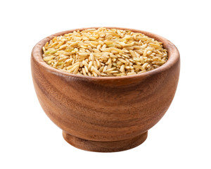 Brown rice in wooden bowl isolated on white background