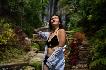 Woman near Labuhan Kebo Waterfall located in Munduk, Bali