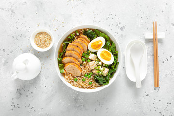 Ramen noodle soup with chicken breast, egg and spinach