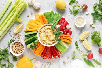 Foto op Plexiglas Hummus with fresh vegetables, healthy vegetarian food concept, top view © Sea Wave