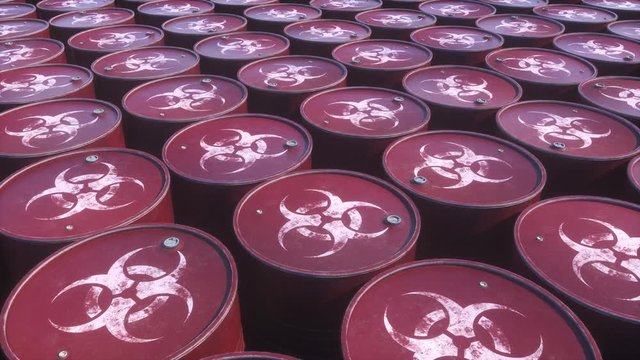 Storage of biohazard metal barrels with toxic waste. Rows of rusty colored waste chemistry red barrels. Environment disaster industrial landfill concept.   