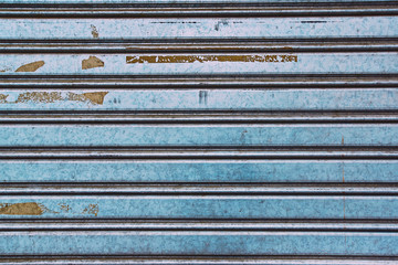 detail of stripped metal garage or store door texture; metal background