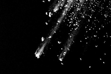 Obraz premium White powder explosion isolated on black background.
