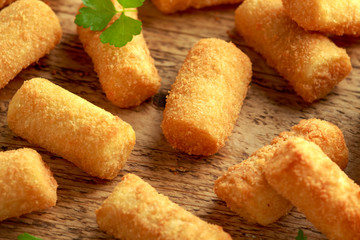 Homemade Potato Croquettes with dipping sauce on wooden board