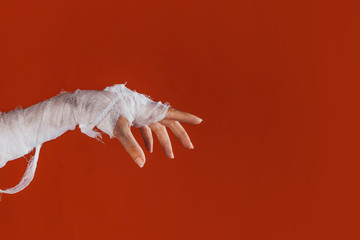 Halloween, costume image. The mummy's hand in bandages making gestures © Alexander