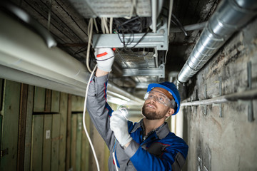 Male Worker Connecting Cables
