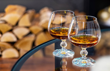 Close-up of two glasses of alcohol drink. Blurred background.