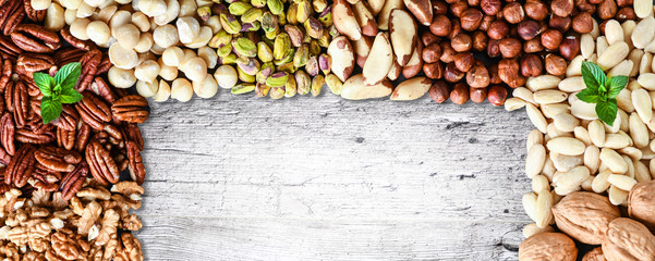 Mixed nuts banner or panorama with copy space for text. Natural healthy background made from...