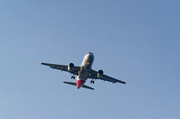 Low angle view of commercial airplane A320 against sky