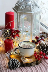 christmas still life with candle and decorations