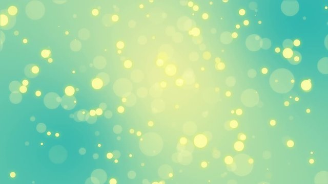 Animated glowing turquoise blue yellow background with floating bokeh light particles.
