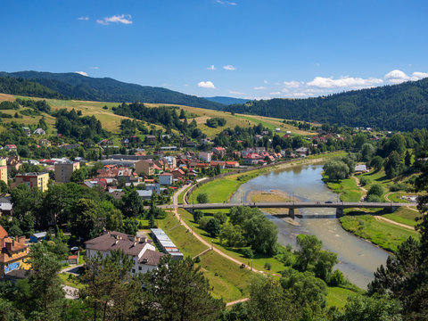 Bridge over Poprad river in spa town Muszyna in summer in southern Poland. View from ruins of castle on Zamczysko mountain.