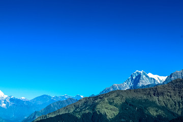 Amazing autumn view with snow-covered mountains