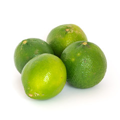 Four limes isolated on white