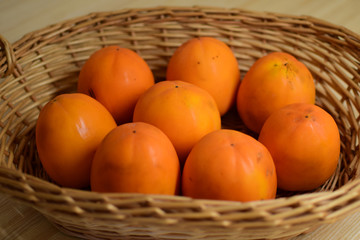 Orange juice persimmon close-up. Food background.