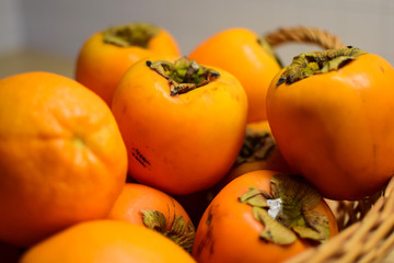 Orange fruits close-up. Oranges, tangerines and persimmons.