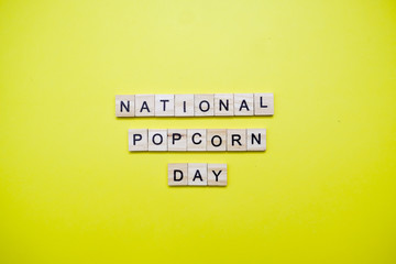 Words on plain background ; National Popcorn Day.