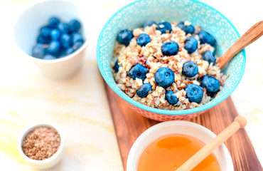 buckwheat porridge with fruits and honey, chia seeds, flax seeds, the concept of a healthy breakfast, diet, veganism, vitamins