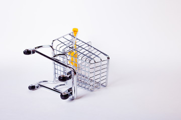 Fallen Shopping cart concept of ended shopping and sales, retail and shops.