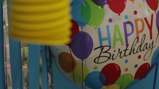 Children balloon happy birthday on party yellow blue colors design decorations background camera movement closeup