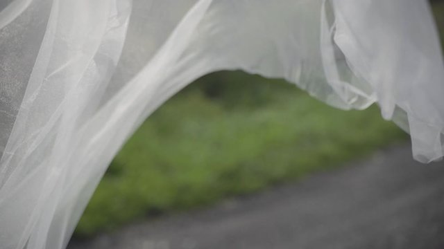 White veil blowing in the wind, slow motion close up