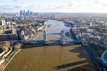 London city centre aerial panorama view: financial district, Thames river, Belfast, skyscrappers, warf and buildings and St. Pauls Cathedral, Tower Bridge and The Tower