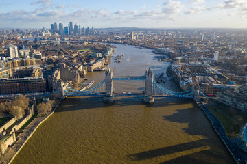 London city centre aerial panorama view: financial district, Thames river, Belfast, skyscrappers, warf and buildings and St. Pauls Cathedral, Tower Bridge and The Tower