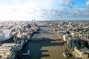 London city centre aerial panorama view: financial district, Thames river, Belfast, skyscrappers, warf and buildings and St. Pauls Cathedral, Tower Bridge and The Tower