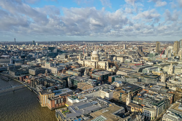 London city centre aerial panorama view: financial district, Thames river, Belfast, skyscrappers, warf and buildings and St. Pauls Cathedral, Tower Bridge and The Tower