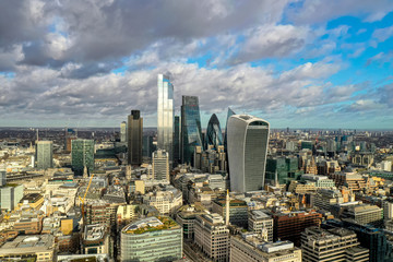 London city centre aerial panorama view: financial district, Thames river, Belfast, skyscrappers, warf and buildings and St. Pauls Cathedral, Tower Bridge and The Tower