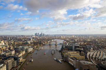 London city centre aerial panorama view: financial district, Thames river, Belfast, skyscrappers, warf and buildings and St. Pauls Cathedral, Tower Bridge and The Tower