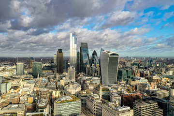 London city centre aerial panorama view: financial district, Thames river, Belfast, skyscrappers, warf and buildings and St. Pauls Cathedral, Tower Bridge and The Tower