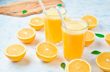 freshly squeezed orange juice and slices of orange fruit