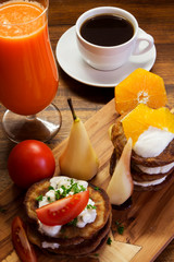 Fresh breakfast, fruit and coffee od wooden desk