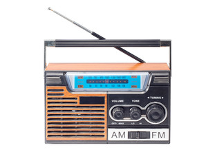 old and obsolete retro FM and AM transistor radio isolated on white background with clipping path