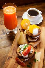 Fresh breakfast, fruit and coffee od wooden desk