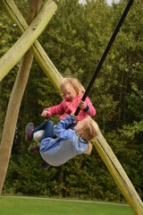 Girls playing outdoor on a swing set