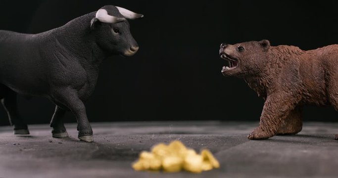 Gold market bearish or bullish trend with bull and bear figures in background. 4k resolution