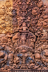 Fototapeta na wymiar Sculpture of Hindu gods on the wall of Banteay Srei, Angkor Wat, Cambodia